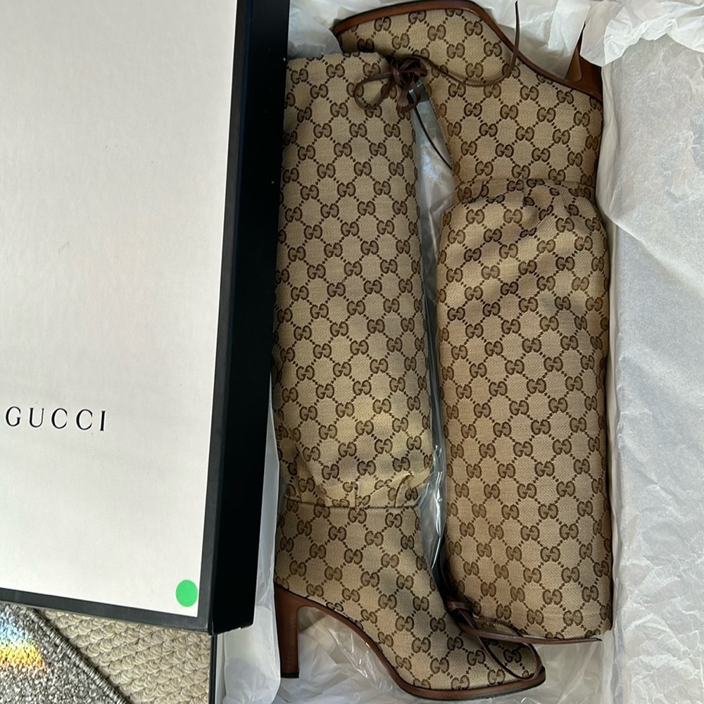 Gucci tall logo tie boots.